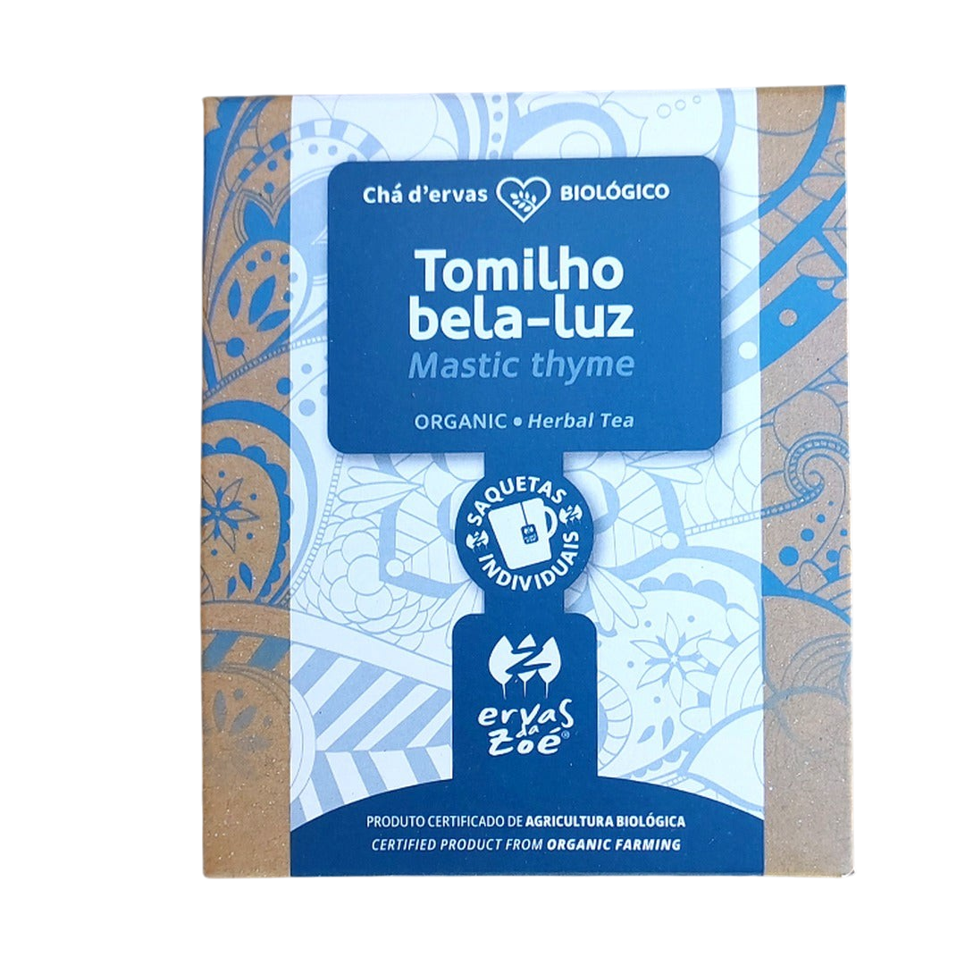 Colheita organic mastic thyme herbal tea sachet box with blue and kraft paper packaging on a stone background